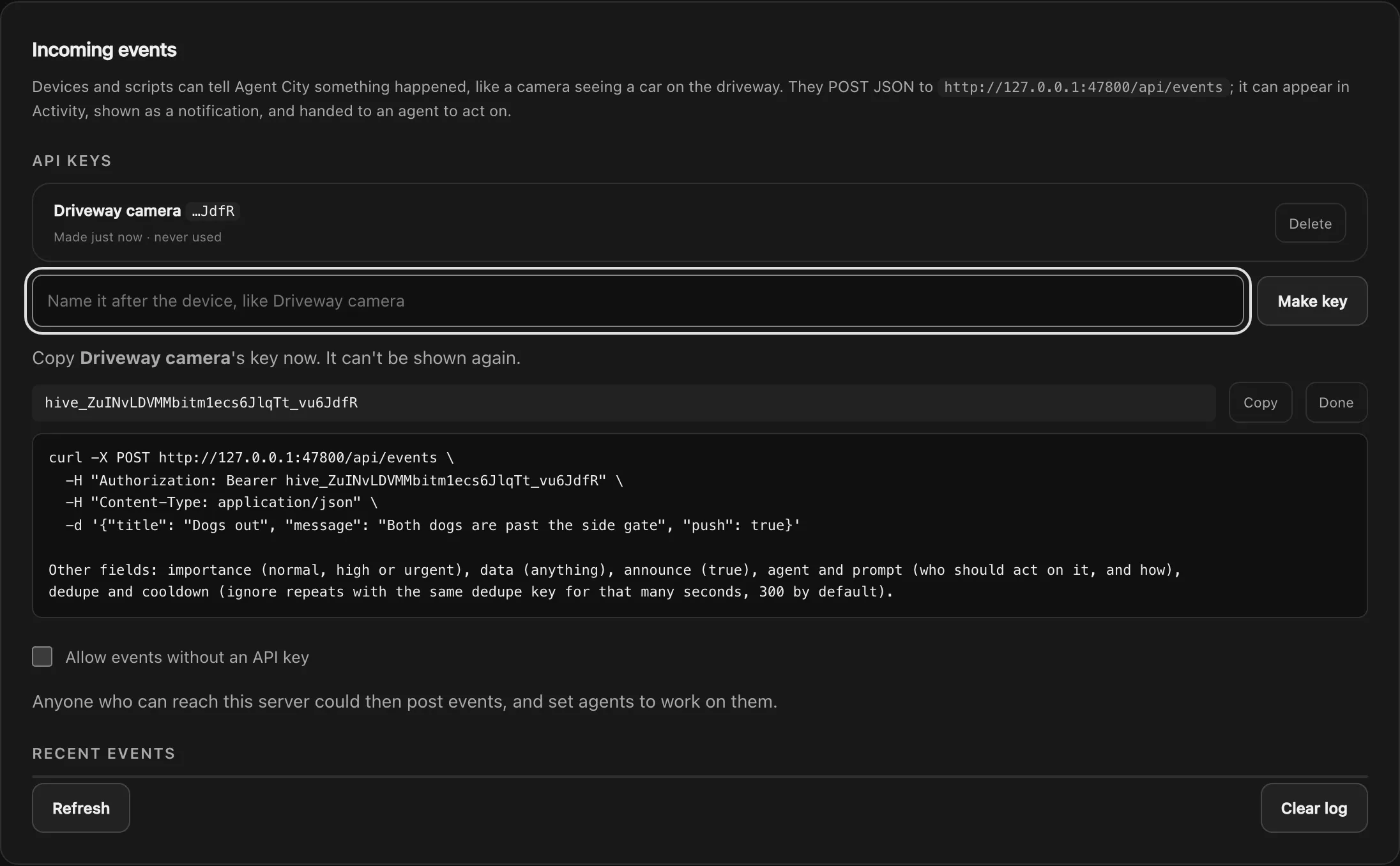 Incoming events with a new key for Driveway camera, a one-time key to copy, and a ready-made curl example